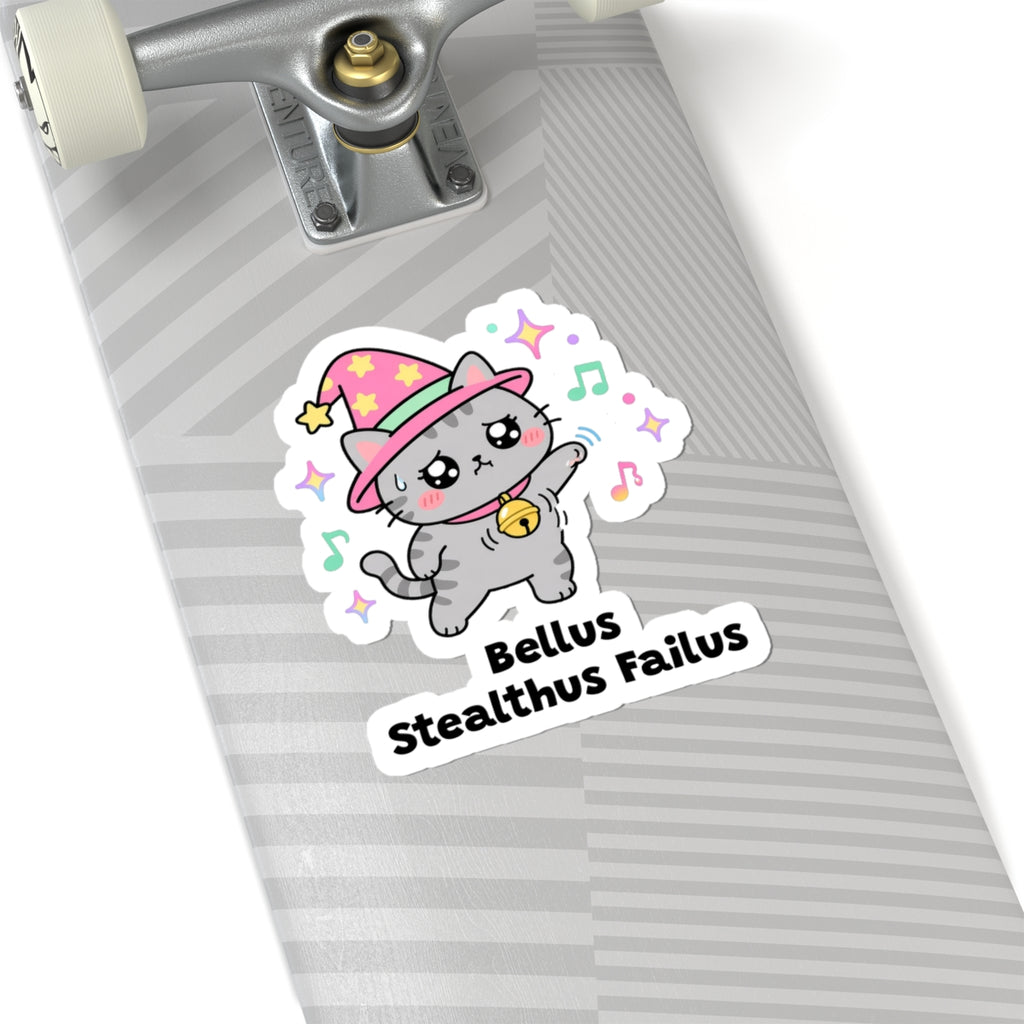 Bellus Stealthus Failus wizard cat sticker on a grey skateboard deck near the truck