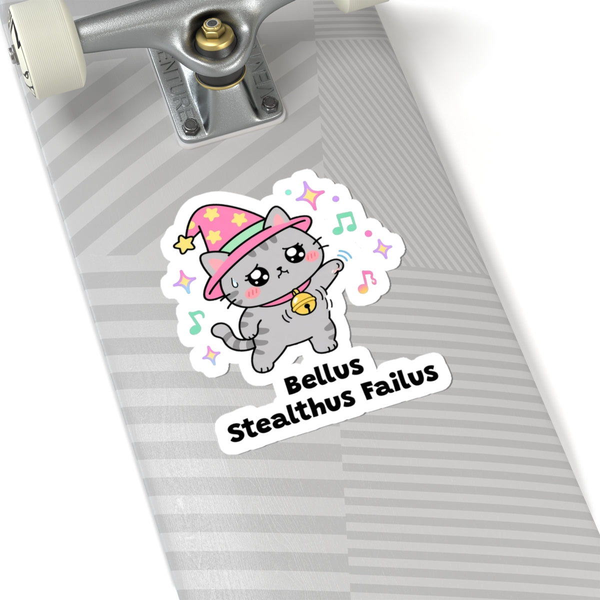 Bellus Stealthus Failus wizard cat sticker on a grey skateboard deck near the truck