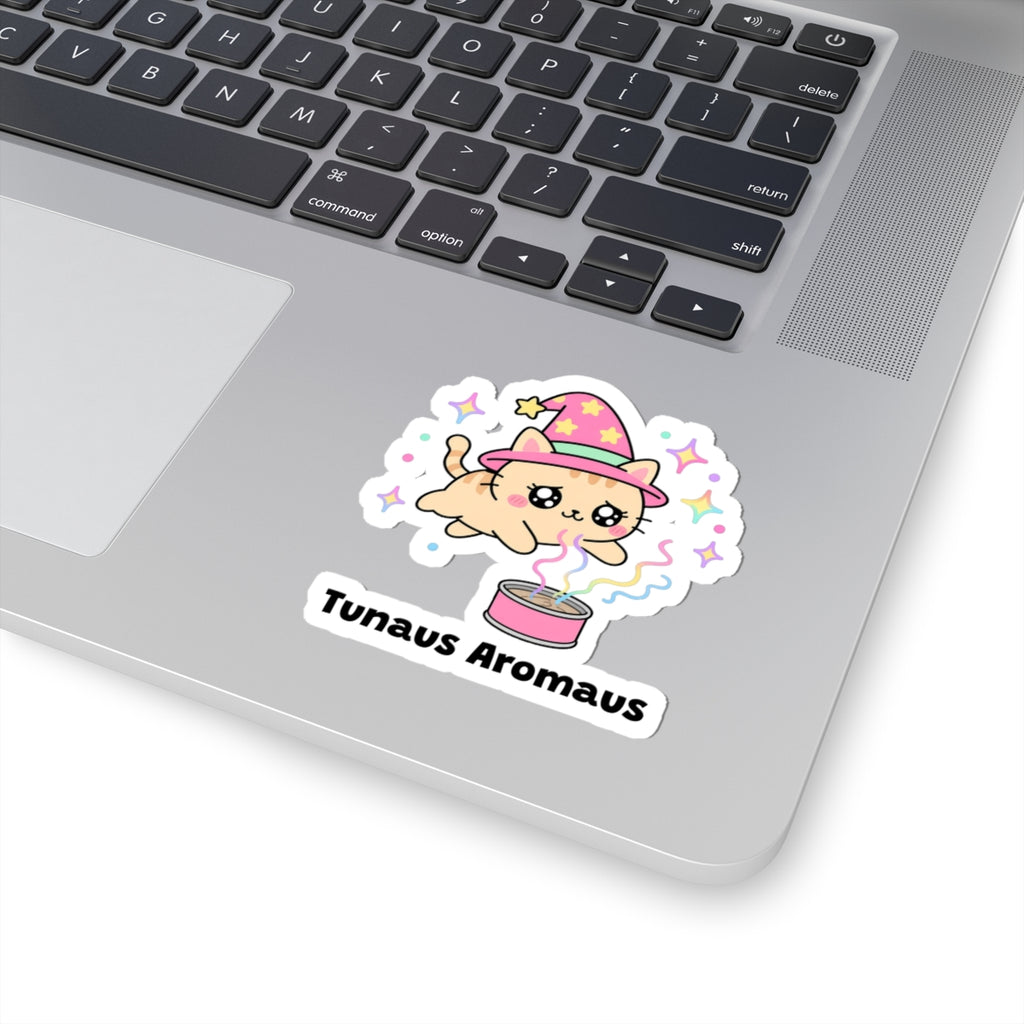 Tunaus Aromaus wizard cat sticker stuck on a silver laptop next to the keyboard