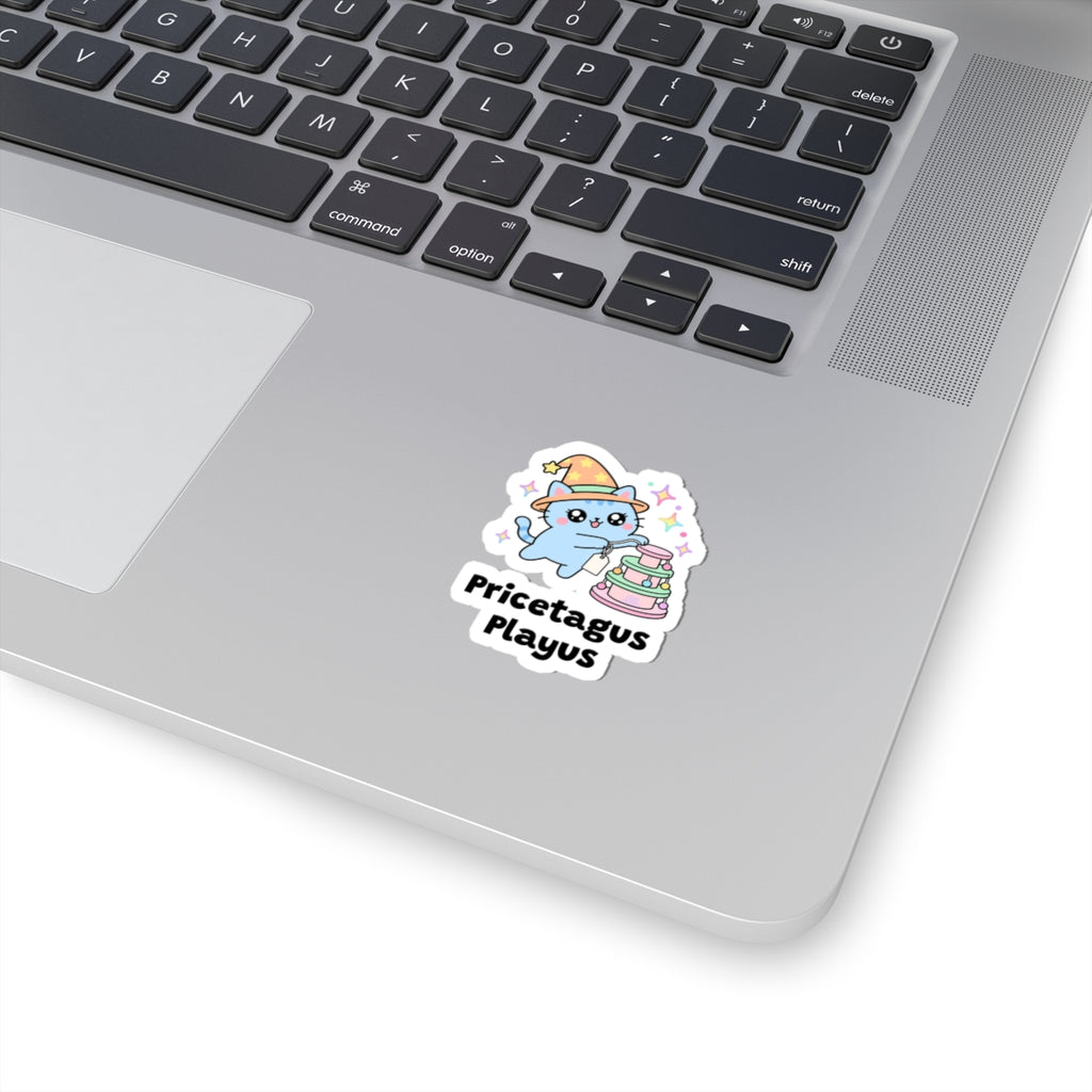 Pricetagus Playus wizard cat sticker stuck on a silver laptop next to the keyboard