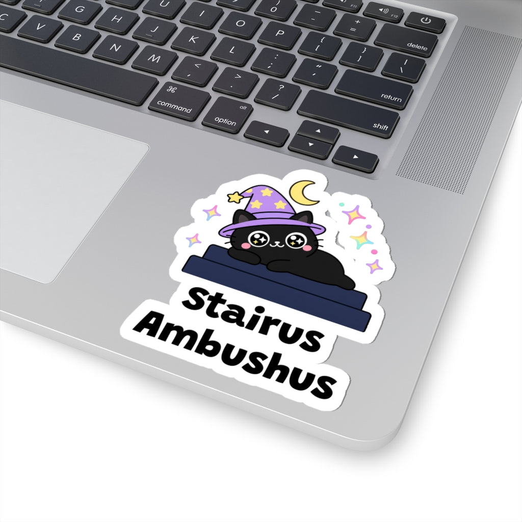 Stairus Ambushus wizard cat sticker stuck on a silver laptop next to the keyboard