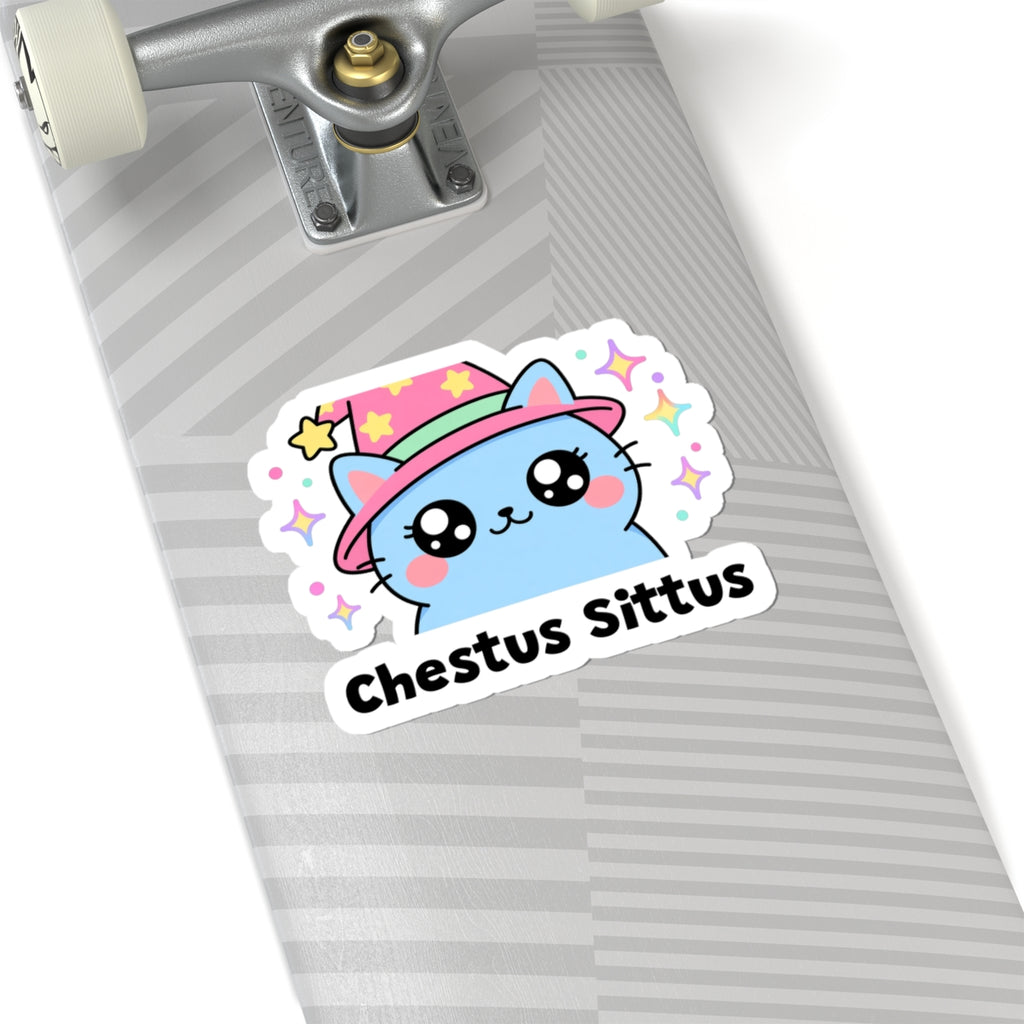Chestus Sittus wizard cat sticker on a grey skateboard deck near the truck