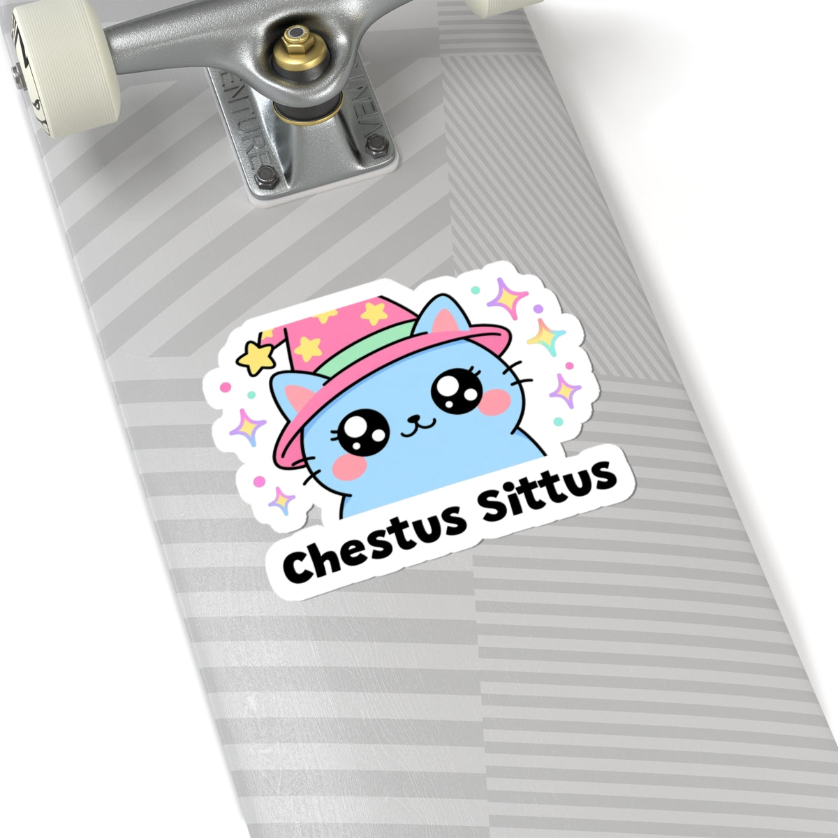 Chestus Sittus wizard cat sticker on a grey skateboard deck near the truck