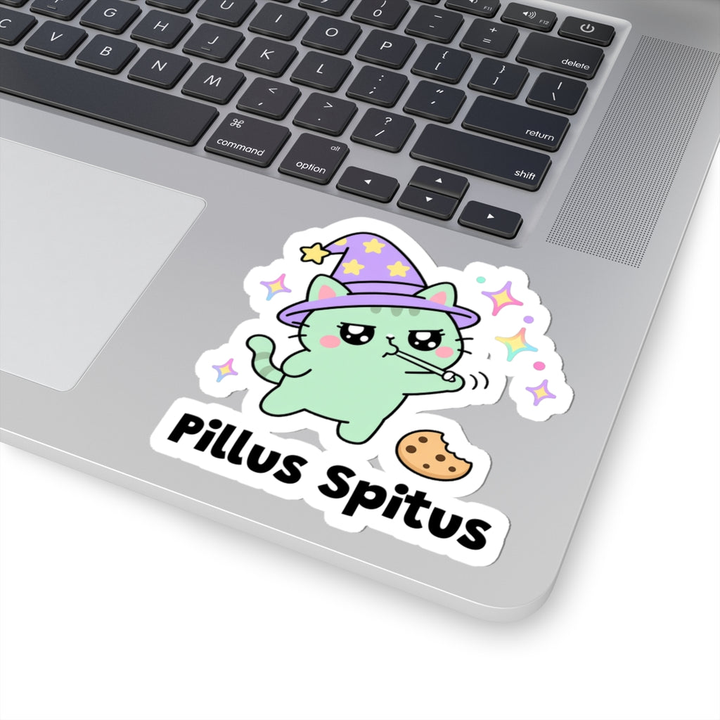 Pillus Spitus wizard cat sticker stuck on a silver laptop next to the keyboard