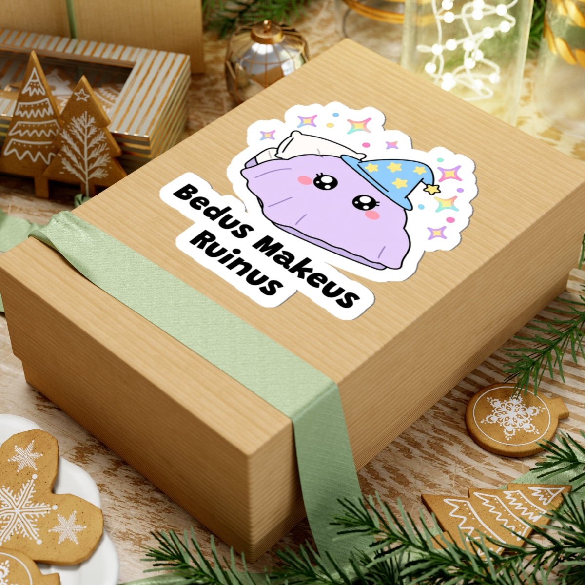 Bedus Makeus Ruinus wizard cat sticker on a kraft gift box with a green ribbon and holiday cookies