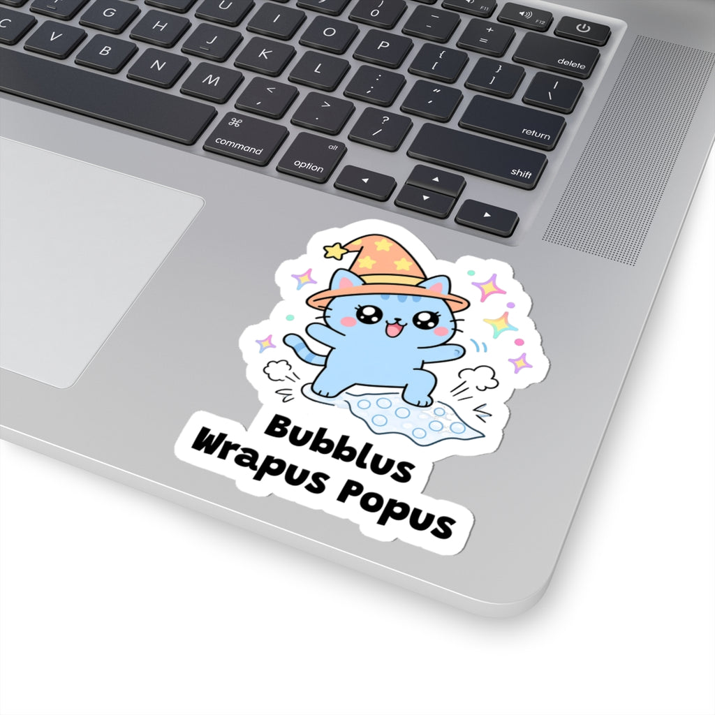Bubblus Wrapus Popus wizard cat sticker stuck on a silver laptop next to the keyboard