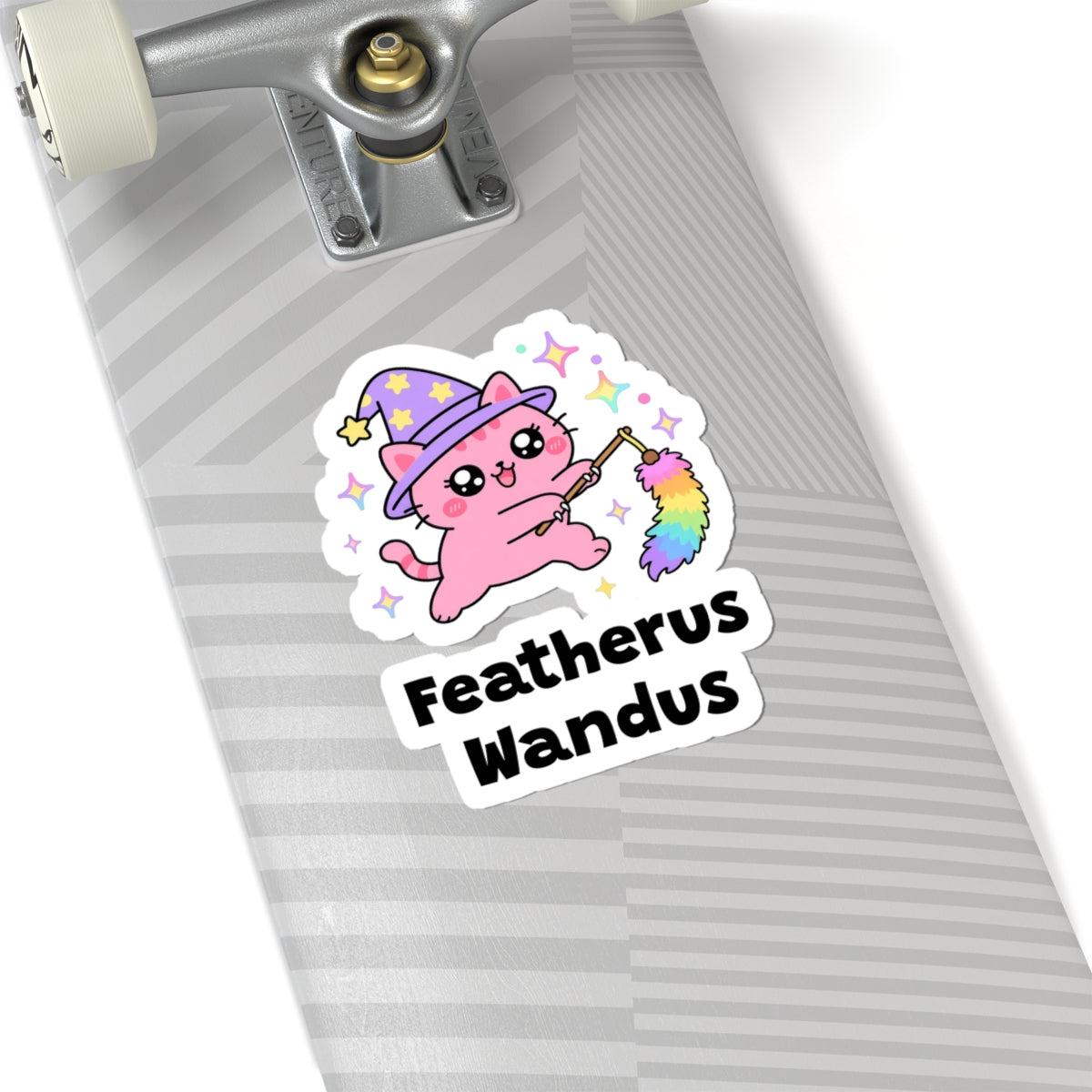 Featherus Wandus wizard cat sticker on a grey skateboard deck near the truck