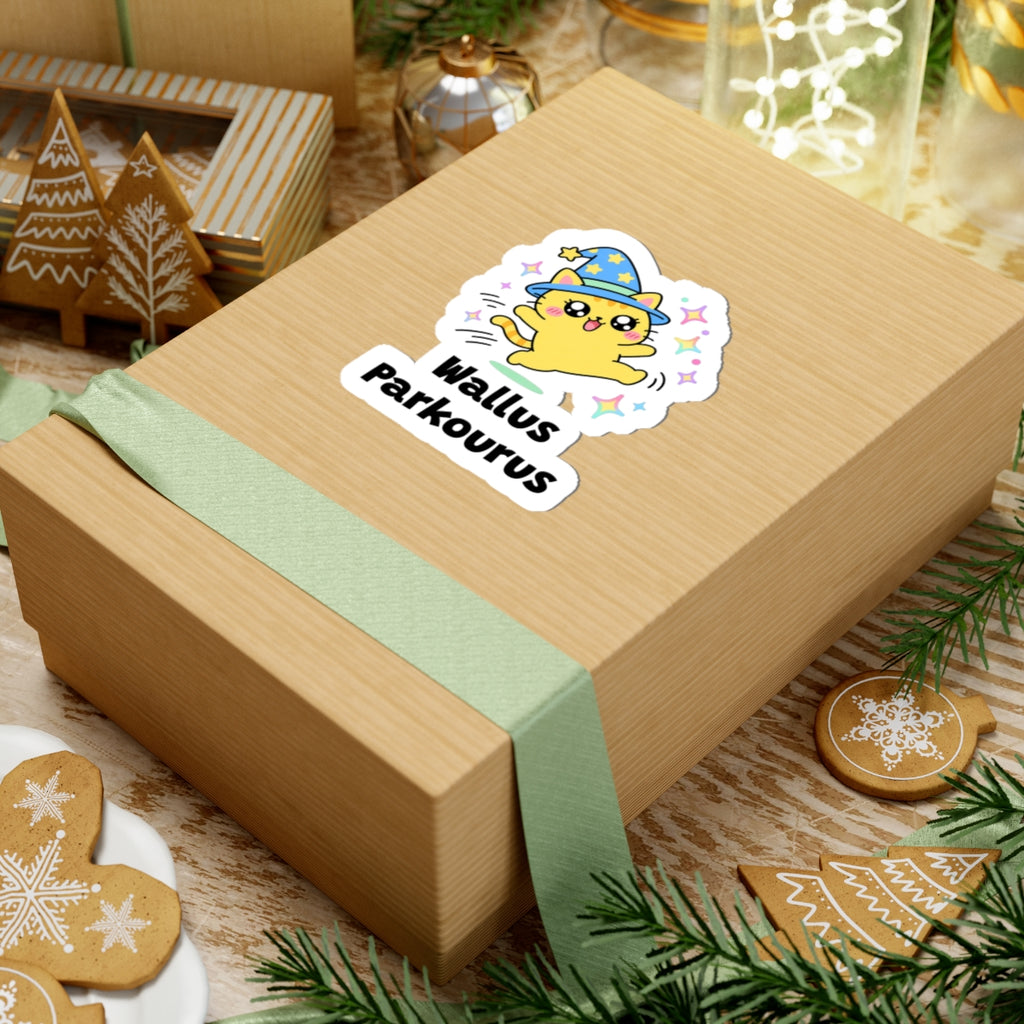 Wallus Parkourus wizard cat sticker on a kraft gift box with a green ribbon and holiday cookies