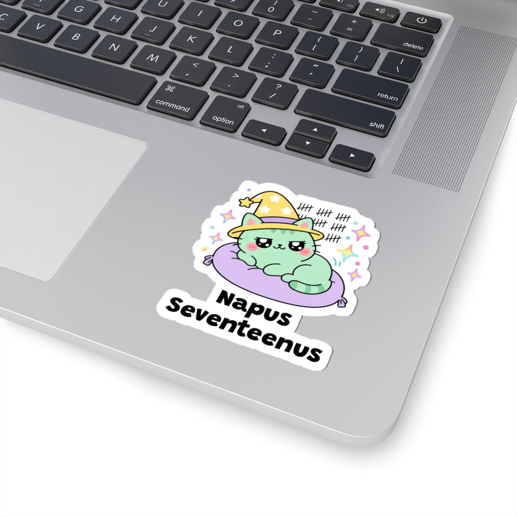 Napus Seventeenus wizard cat sticker stuck on a silver laptop next to the keyboard