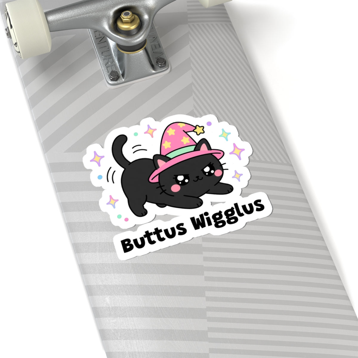 Buttus Wigglus wizard cat sticker on a grey skateboard deck near the truck