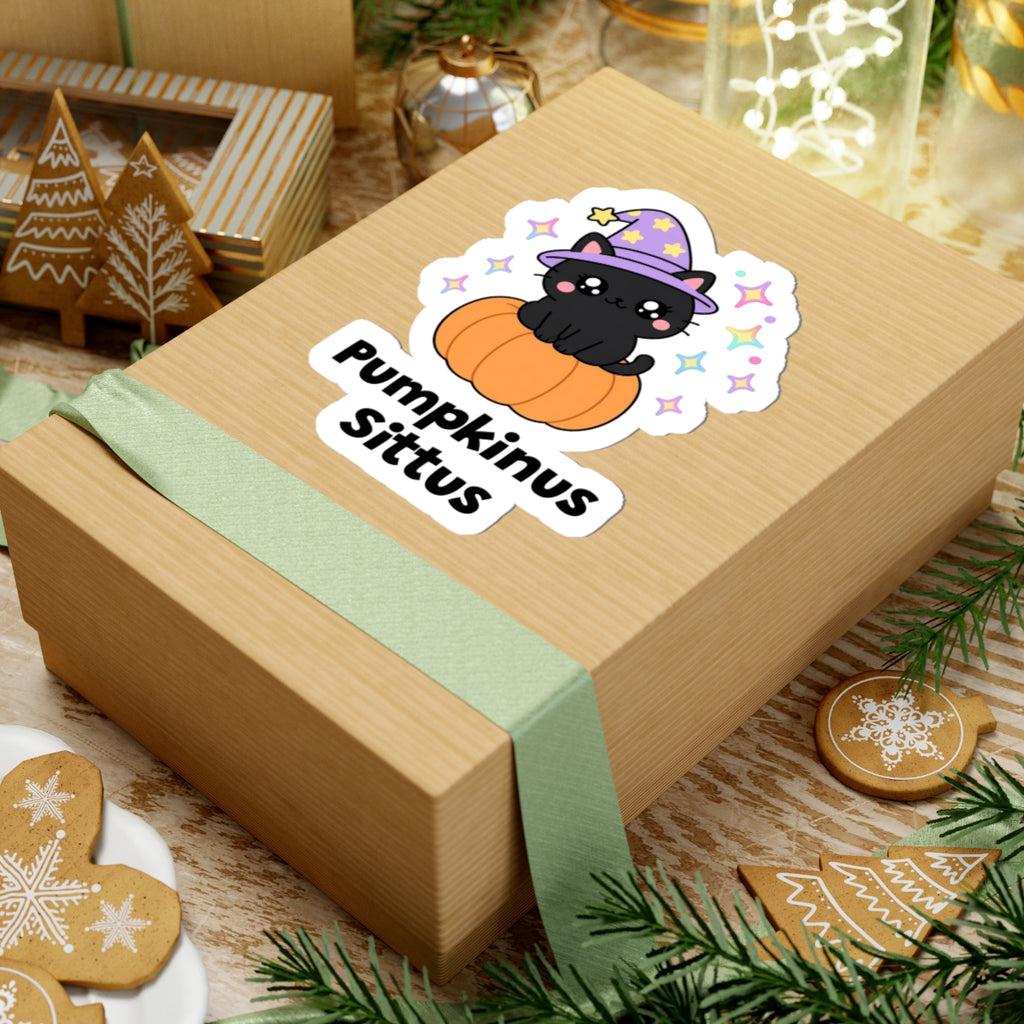 Pumpkinus Sittus wizard cat sticker on a kraft gift box with a green ribbon and holiday cookies