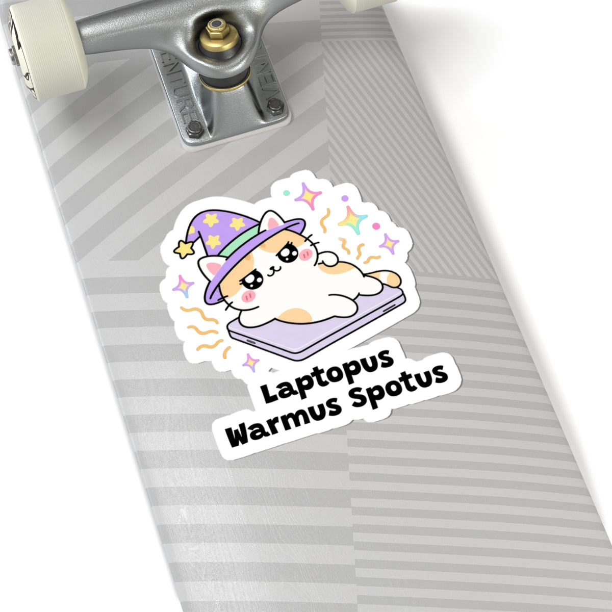 Laptopus Warmus Spotus wizard cat sticker on a grey skateboard deck near the truck