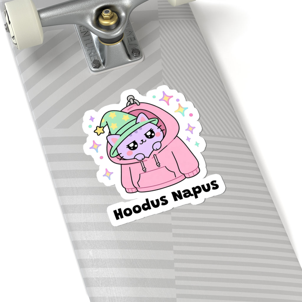 Hoodus Napus wizard cat sticker on a grey skateboard deck near the truck