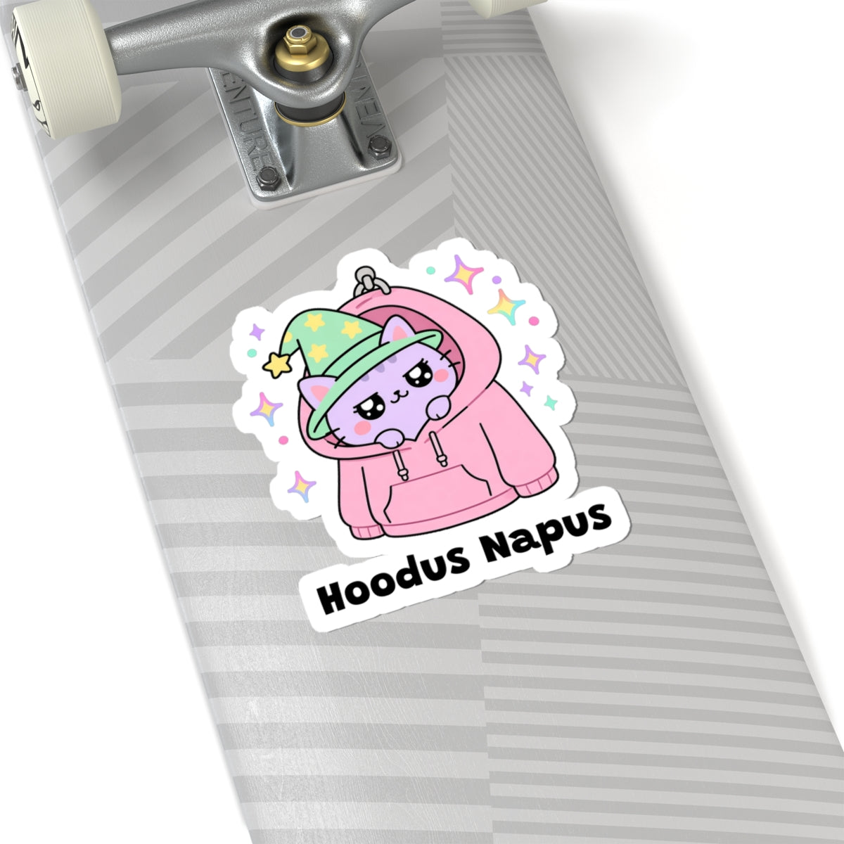 Hoodus Napus wizard cat sticker on a grey skateboard deck near the truck