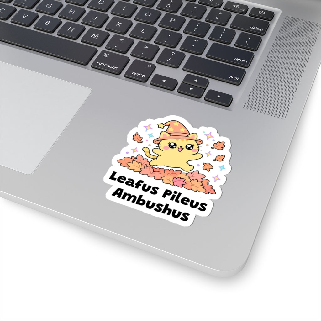 Leafus Pileus Ambushus wizard cat sticker stuck on a silver laptop next to the keyboard