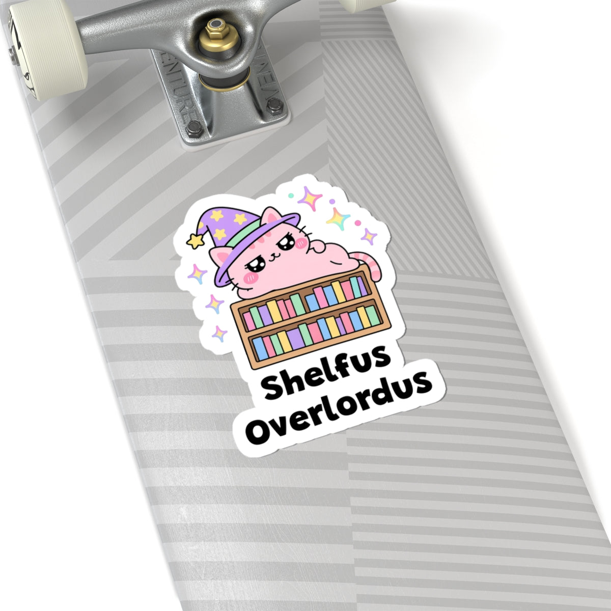Shelfus Overlordus wizard cat sticker on a grey skateboard deck near the truck