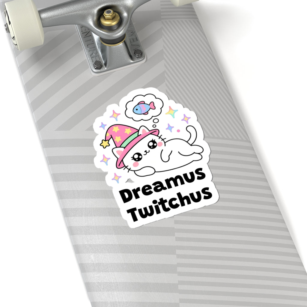 Dreamus Twitchus wizard cat sticker on a grey skateboard deck near the truck