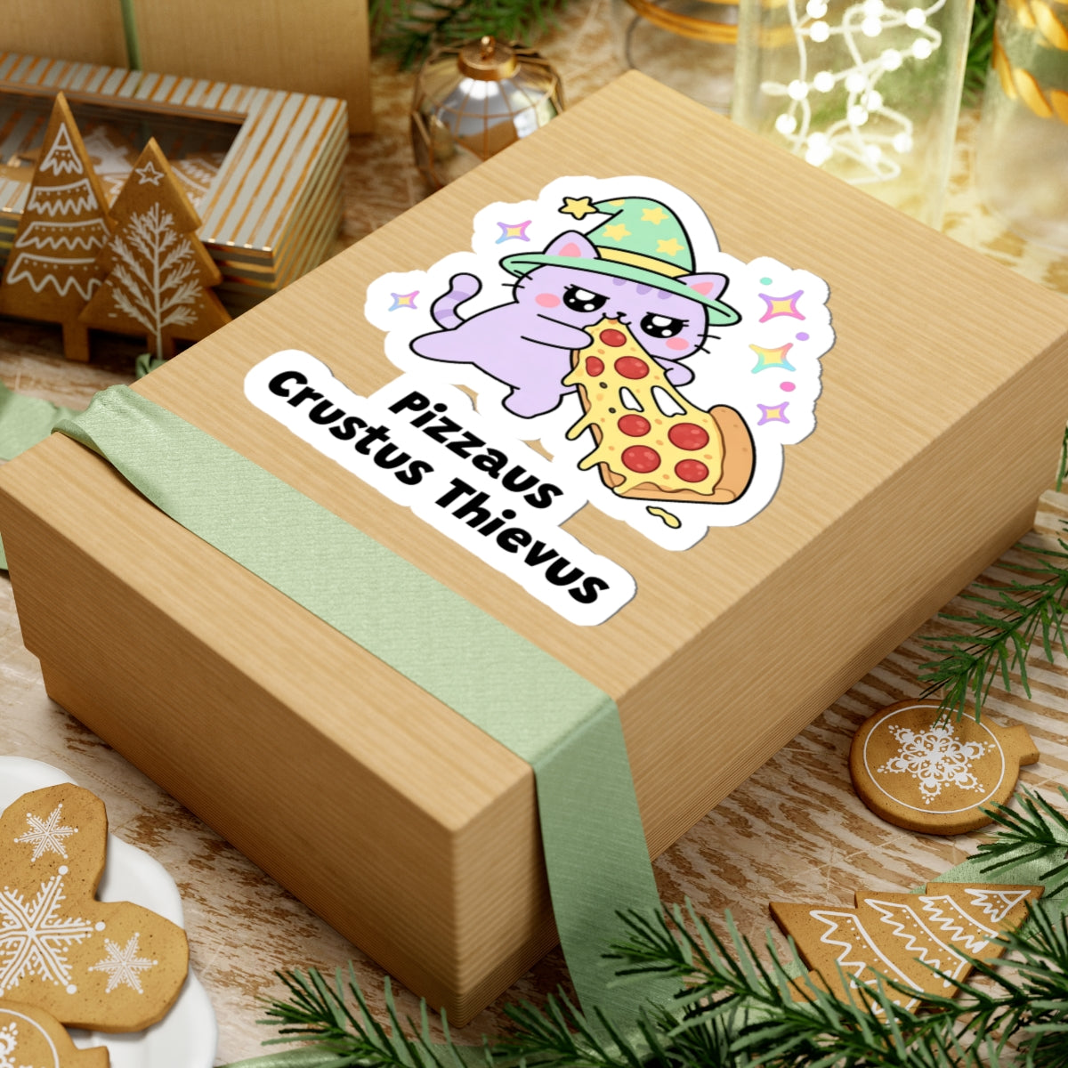 Pizzaus Crustus Thievus wizard cat sticker on a kraft gift box with a green ribbon and holiday cookies