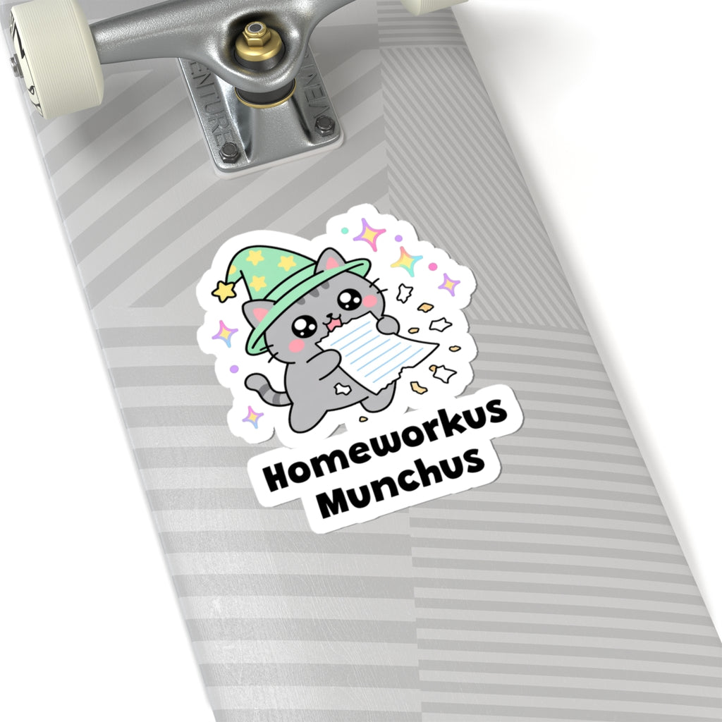 Homeworkus Munchus wizard cat sticker on a grey skateboard deck near the truck