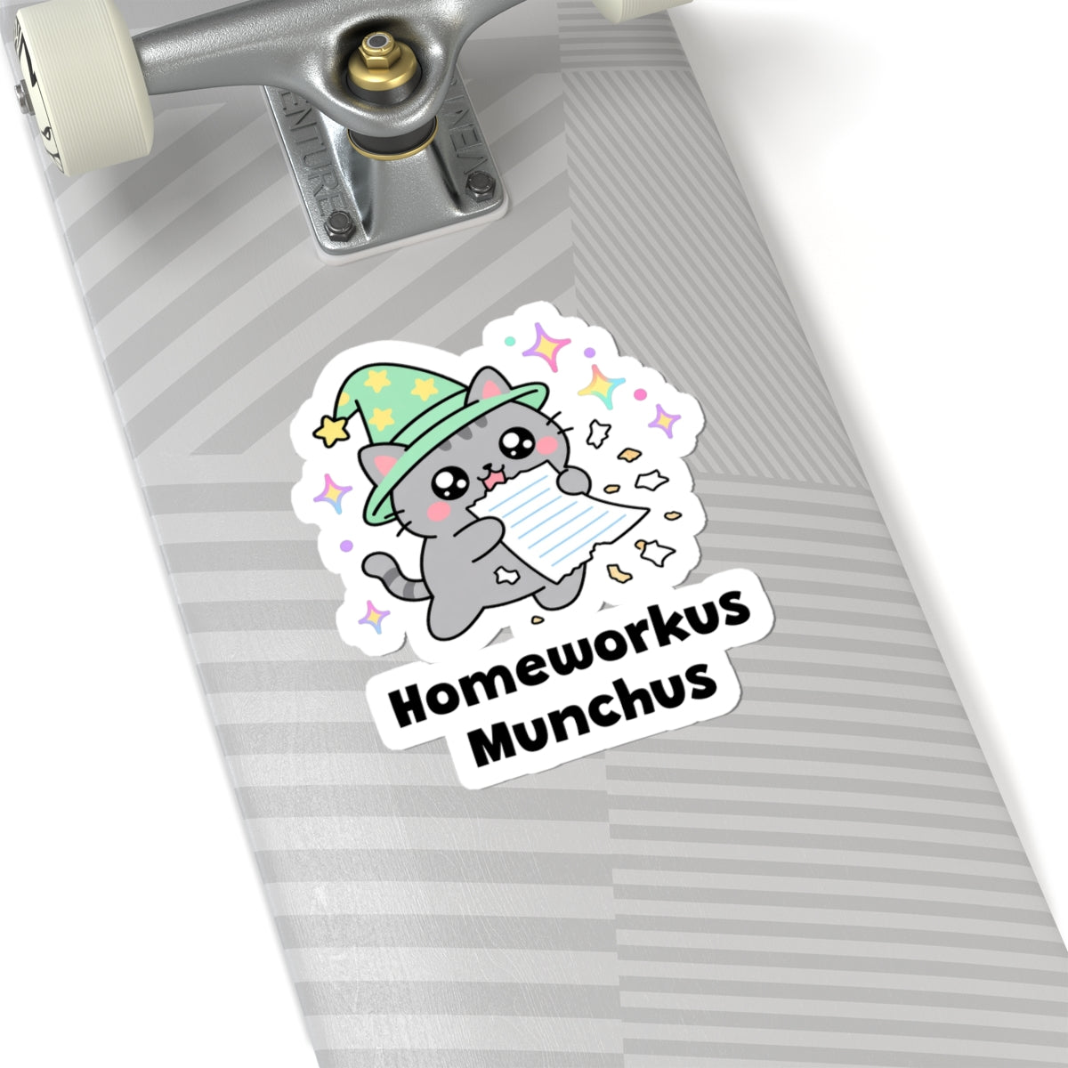 Homeworkus Munchus wizard cat sticker on a grey skateboard deck near the truck