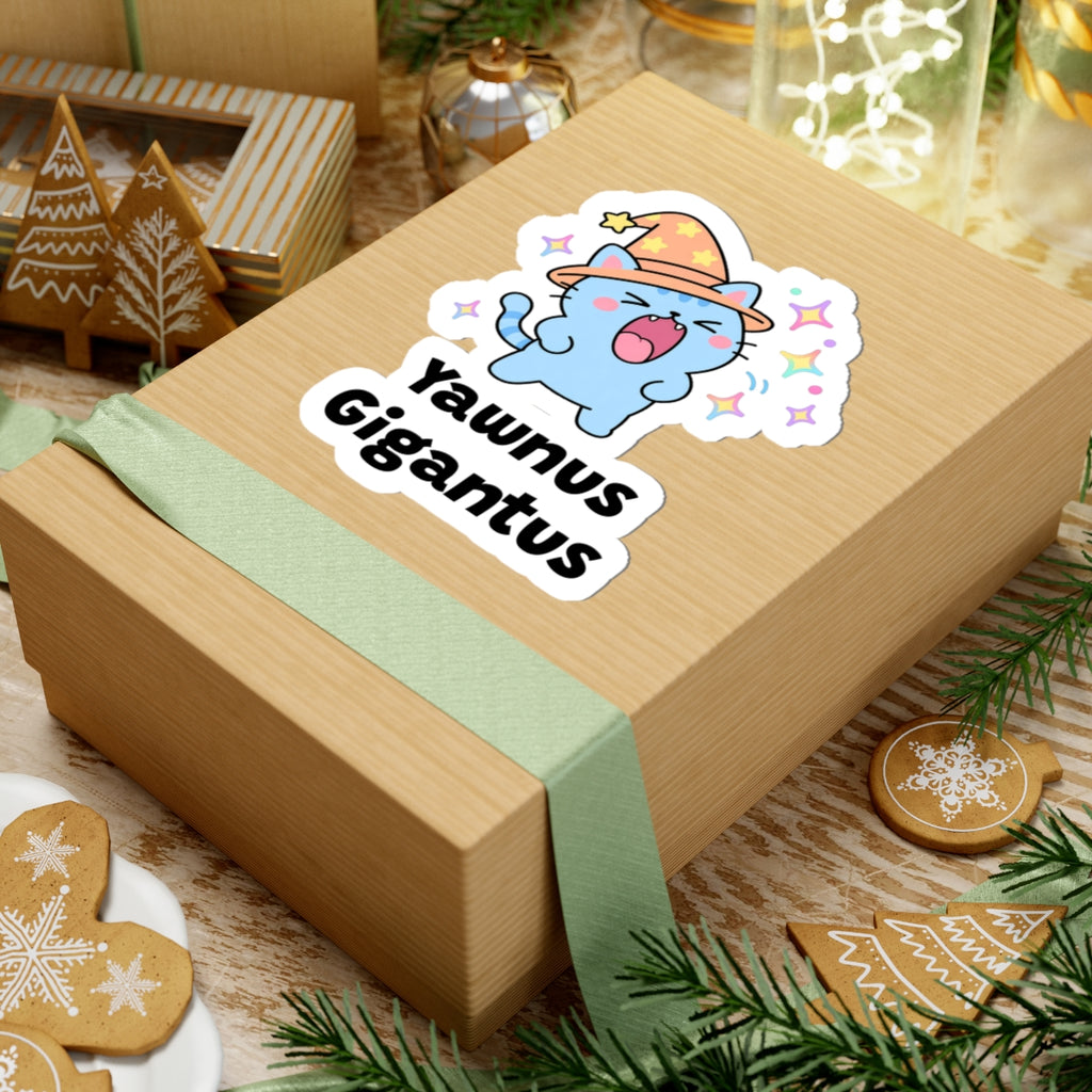 Yawnus Gigantus wizard cat sticker on a kraft gift box with a green ribbon and holiday cookies