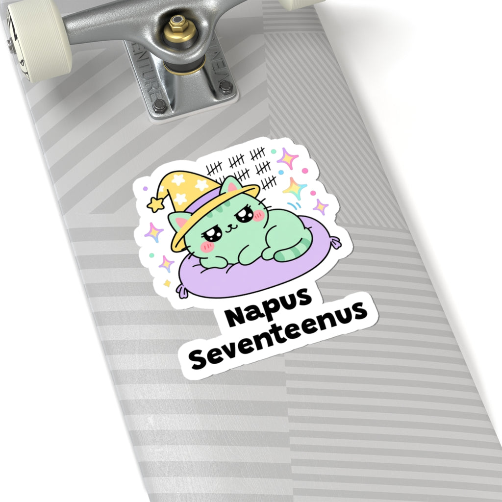 Napus Seventeenus wizard cat sticker on a grey skateboard deck near the truck