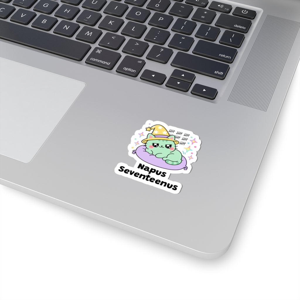 Napus Seventeenus wizard cat sticker stuck on a silver laptop next to the keyboard