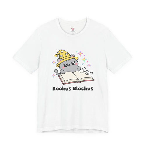 Gray wizard cat in a yellow hat lying across the pages of an open book, Bookus Blockus tee