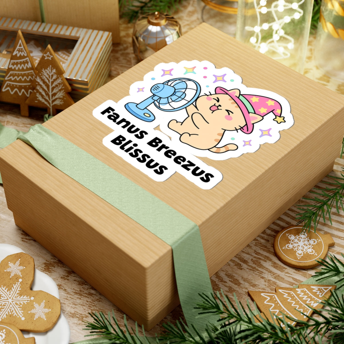 Fanus Breezus Blissus wizard cat sticker on a kraft gift box with a green ribbon and holiday cookies