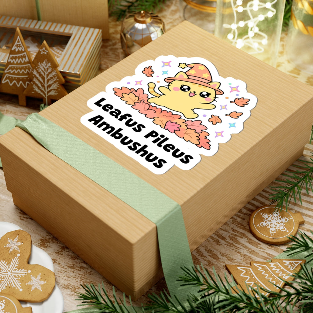 Leafus Pileus Ambushus wizard cat sticker on a kraft gift box with a green ribbon and holiday cookies