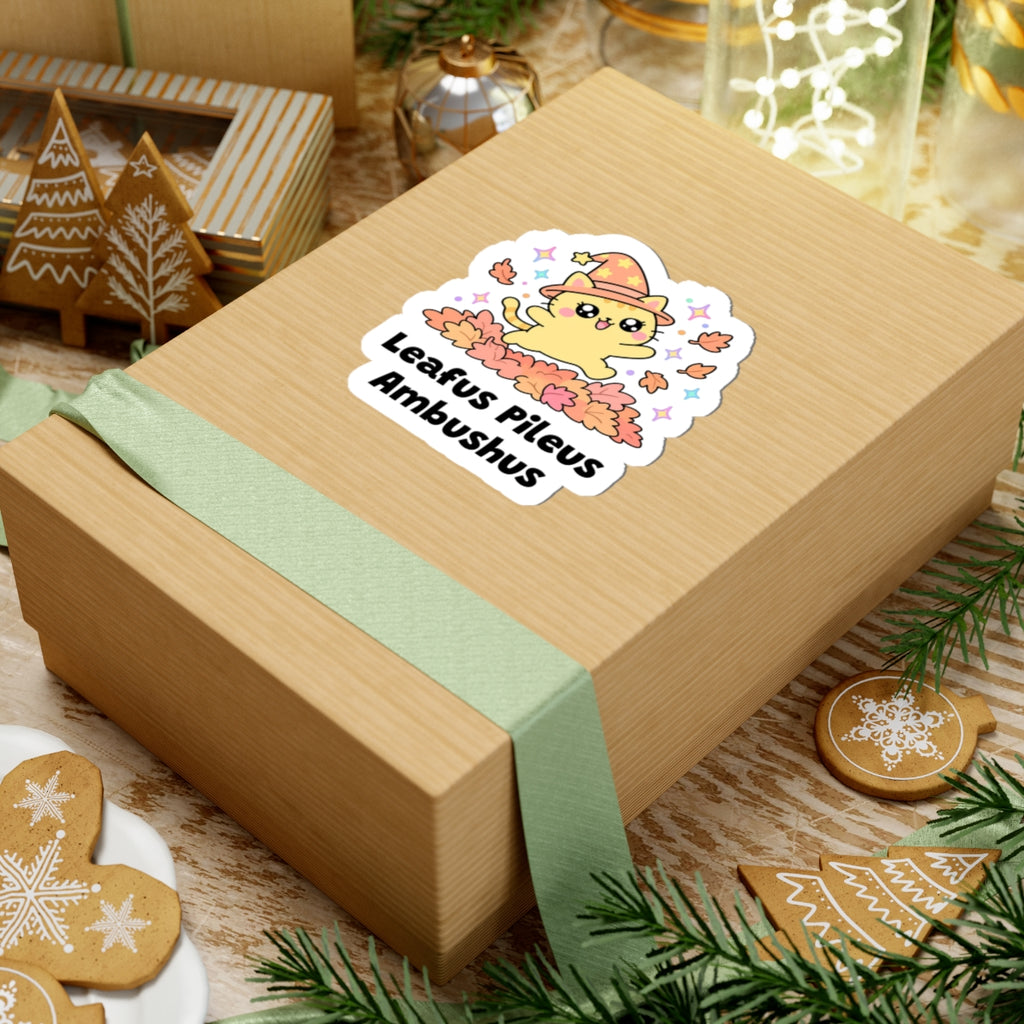 Leafus Pileus Ambushus wizard cat sticker on a kraft gift box with a green ribbon and holiday cookies