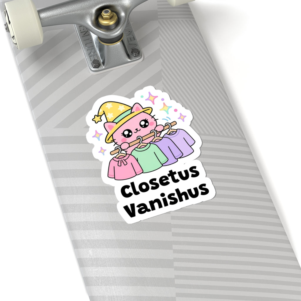 Closetus Vanishus wizard cat sticker on a grey skateboard deck near the truck