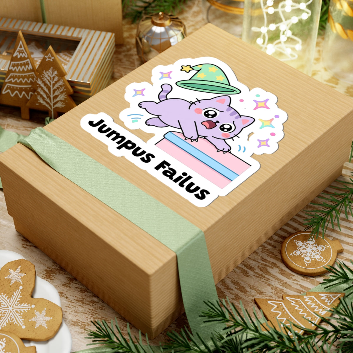 Jumpus Failus wizard cat sticker on a kraft gift box with a green ribbon and holiday cookies