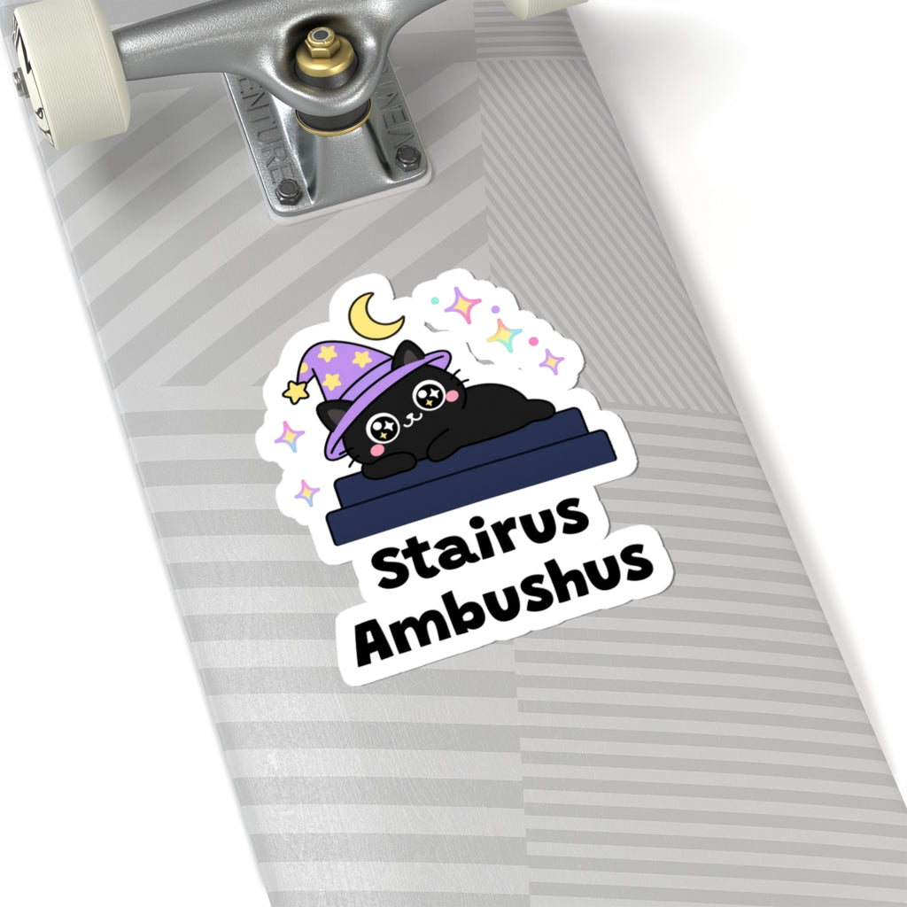 Stairus Ambushus wizard cat sticker on a grey skateboard deck near the truck