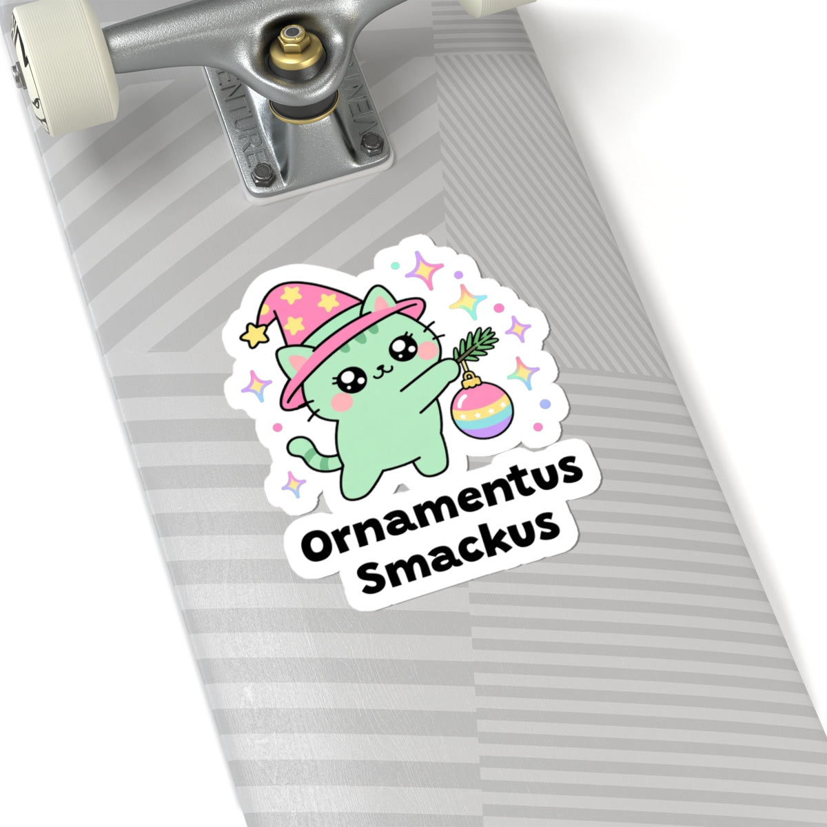 Ornamentus Smackus wizard cat sticker on a grey skateboard deck near the truck