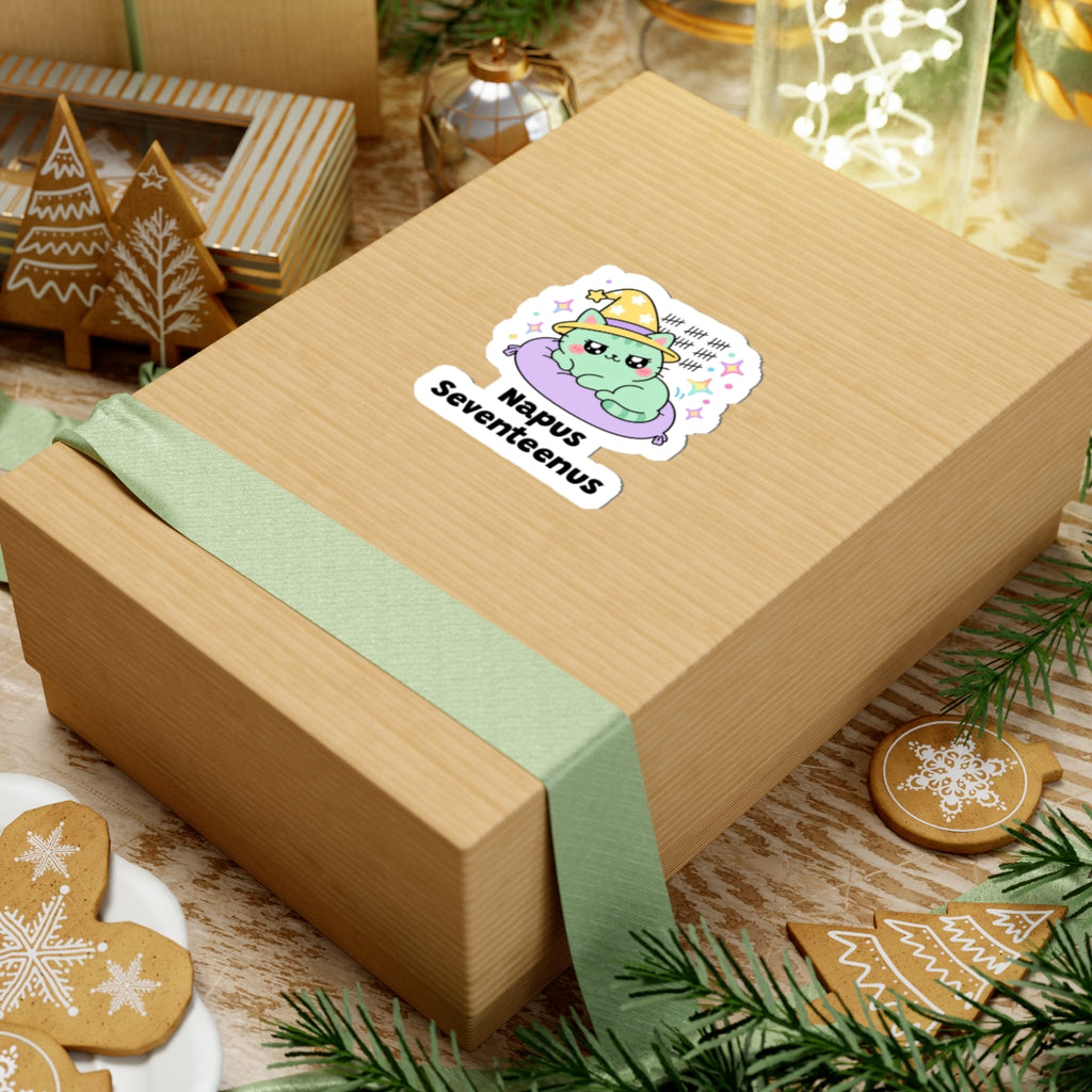 Napus Seventeenus wizard cat sticker on a kraft gift box with a green ribbon and holiday cookies