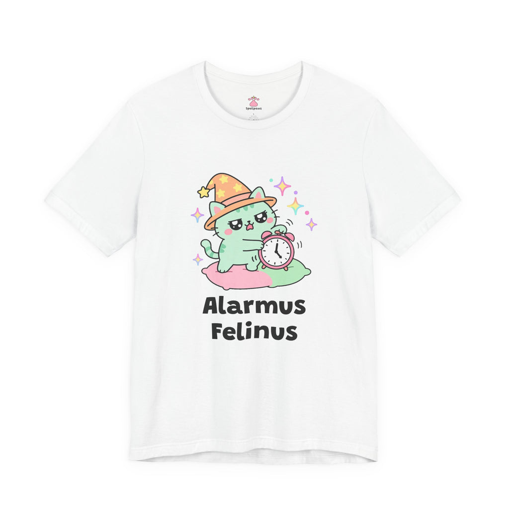 White Alarmus Felinus wizard cat T-shirt, front view: mint-green wizard cat in an orange hat on a pink pillow, pawing a ringing alarm clock, with "Alarmus Felinus" printed below