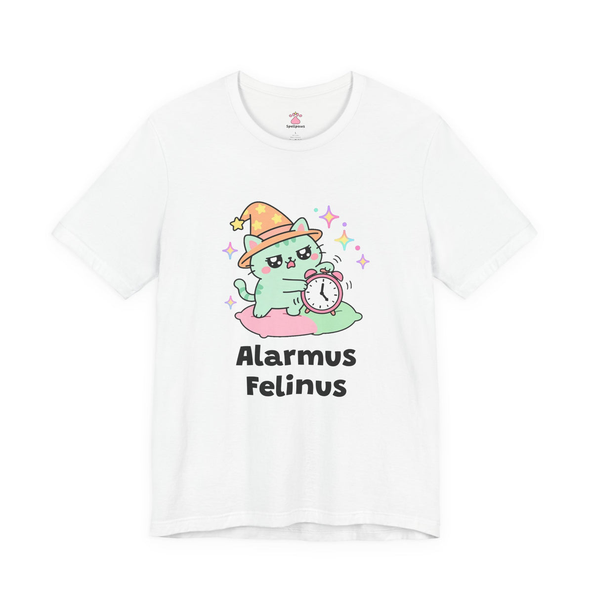 White Alarmus Felinus wizard cat T-shirt, front view: mint-green wizard cat in an orange hat on a pink pillow, pawing a ringing alarm clock, with "Alarmus Felinus" printed below