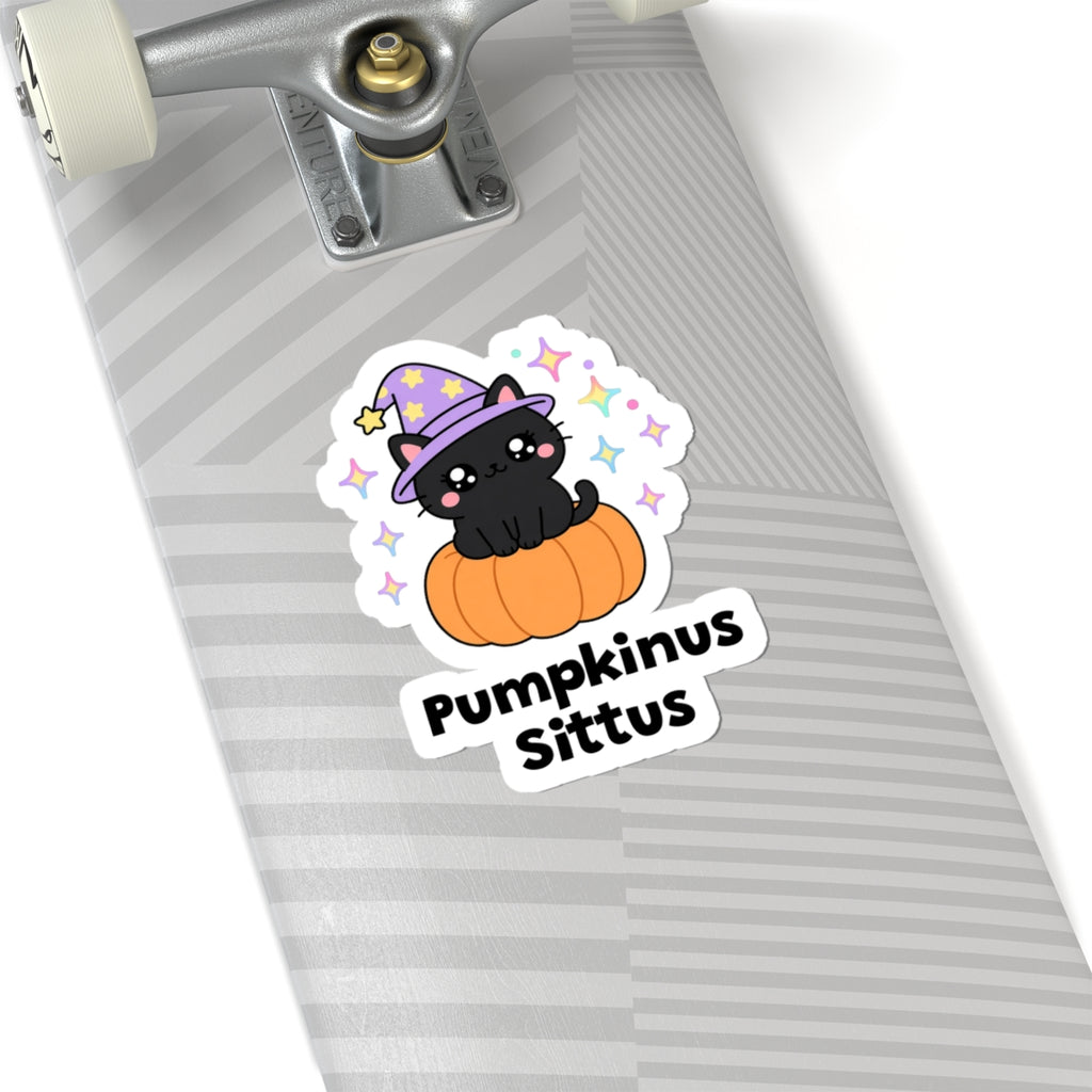 Pumpkinus Sittus wizard cat sticker on a grey skateboard deck near the truck