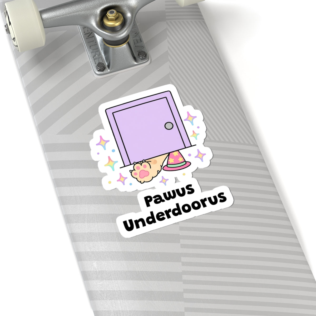 Pawus Underdoorus wizard cat sticker on a grey skateboard deck near the truck