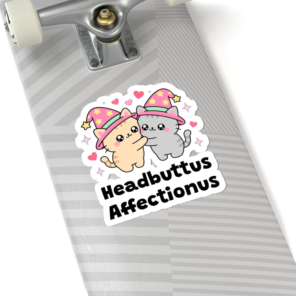 Headbuttus Affectionus wizard cat sticker on a grey skateboard deck near the truck
