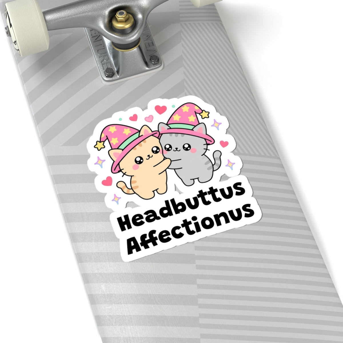 Headbuttus Affectionus wizard cat sticker on a grey skateboard deck near the truck
