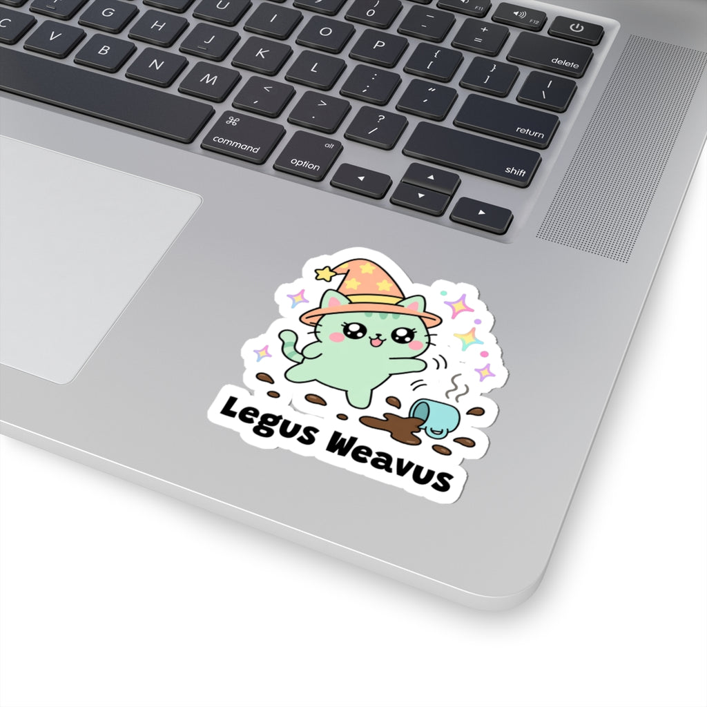 Legus Weavus wizard cat sticker stuck on a silver laptop next to the keyboard