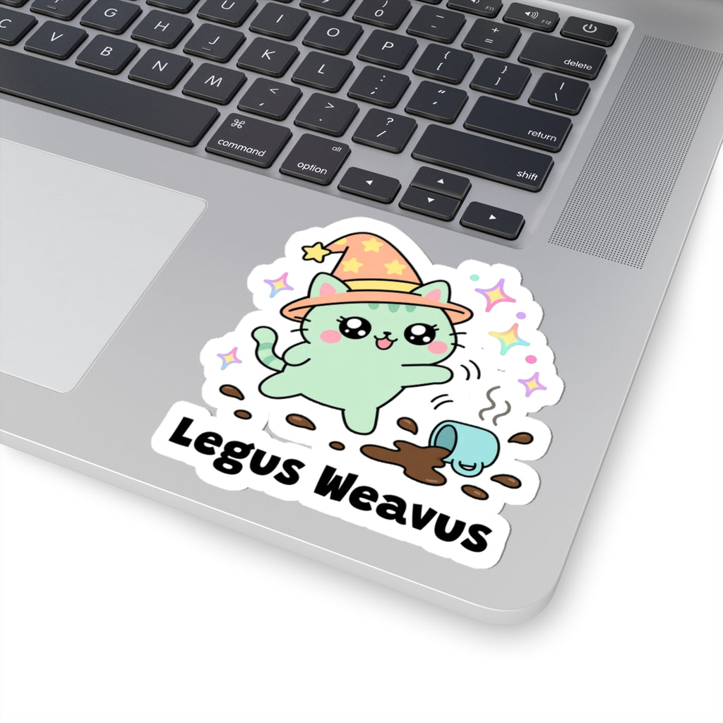 Legus Weavus wizard cat sticker stuck on a silver laptop next to the keyboard
