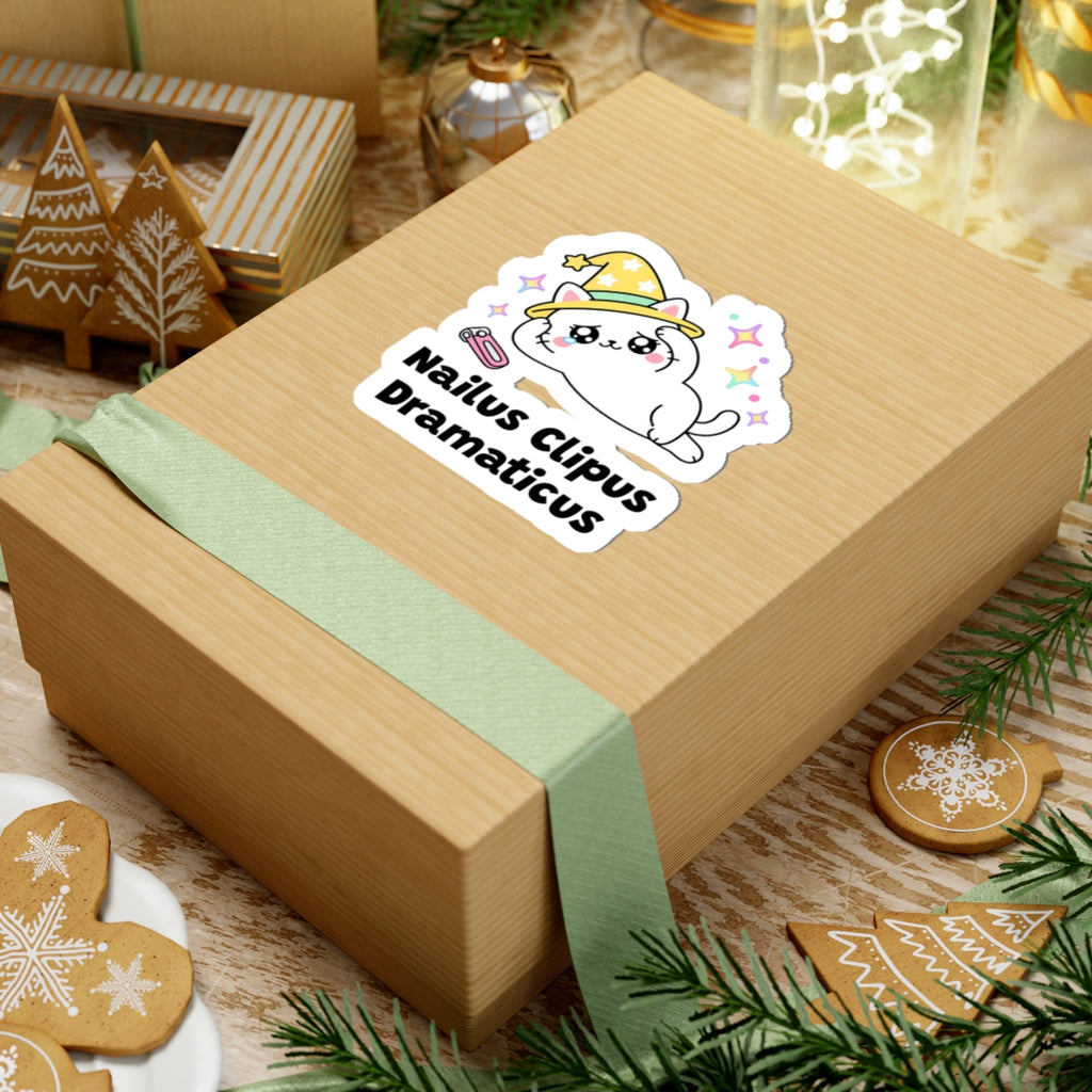 Nailus Clipus Dramaticus wizard cat sticker on a kraft gift box with a green ribbon and holiday cookies