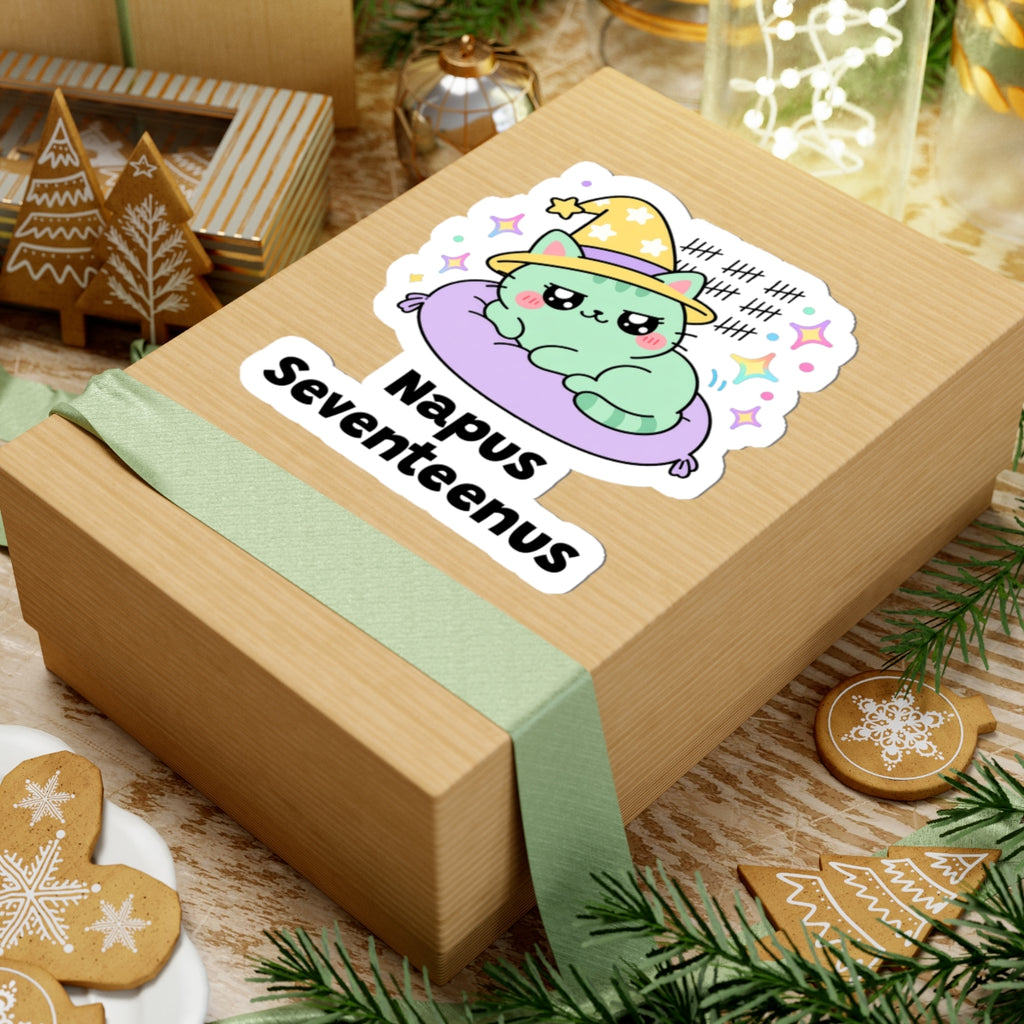 Napus Seventeenus wizard cat sticker on a kraft gift box with a green ribbon and holiday cookies