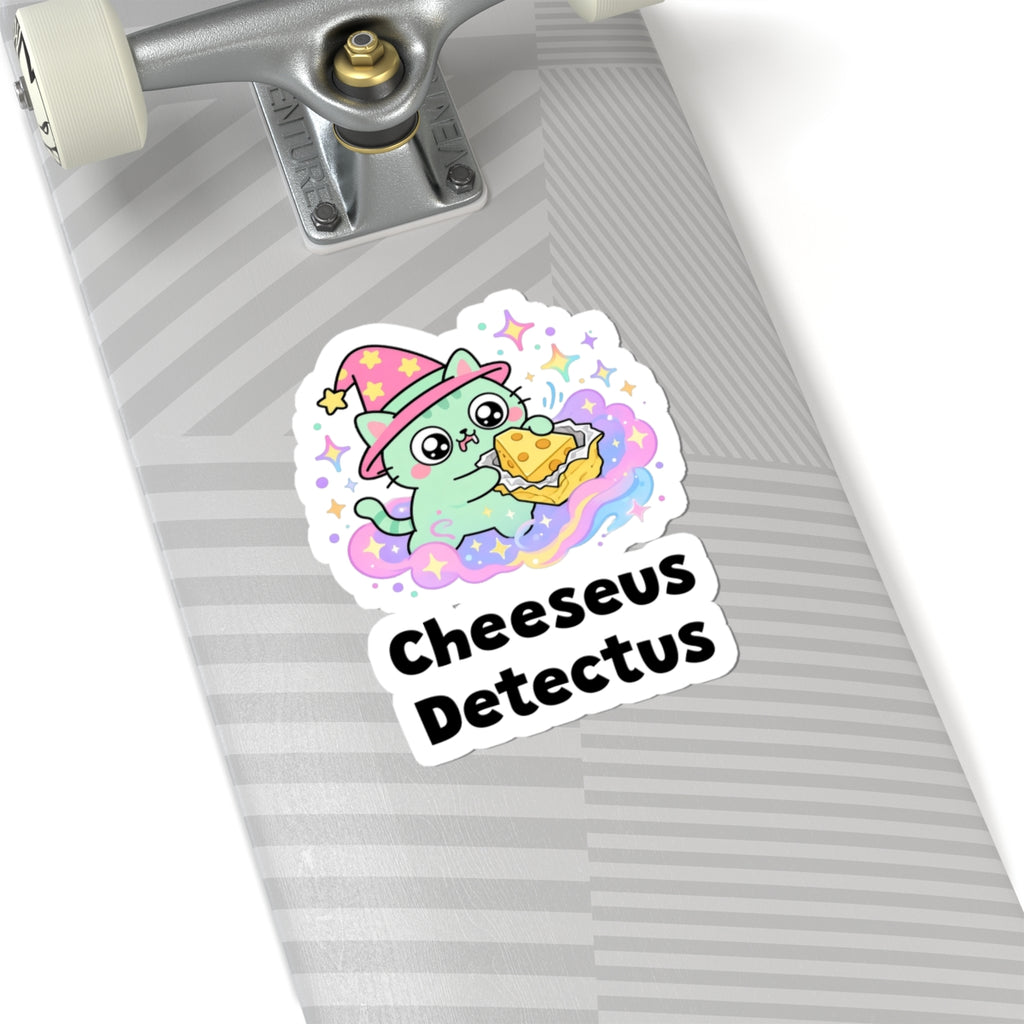 Cheeseus Detectus wizard cat sticker on a grey skateboard deck near the truck