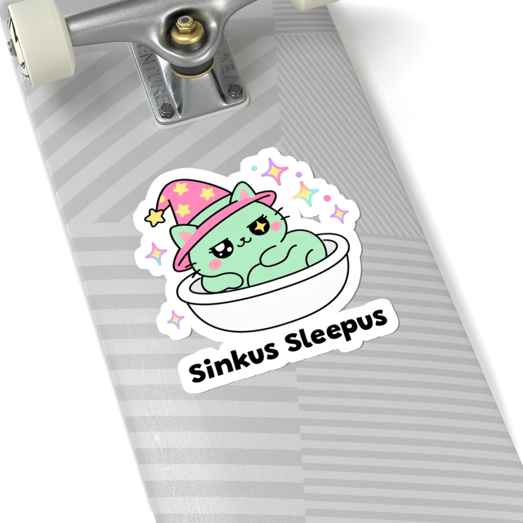 Sinkus Sleepus wizard cat sticker on a grey skateboard deck near the truck
