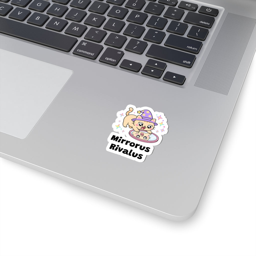 Mirrorus Rivalus wizard cat sticker stuck on a silver laptop next to the keyboard