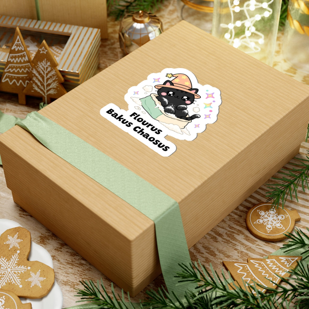 Flourus Bakus Chaosus wizard cat sticker on a kraft gift box with a green ribbon and holiday cookies